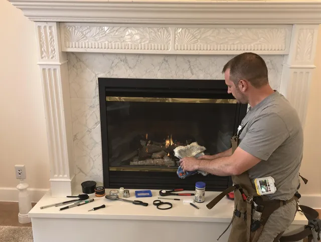 Kingston Chimney Sweep performing fireplace maintenance in Kingston, MA